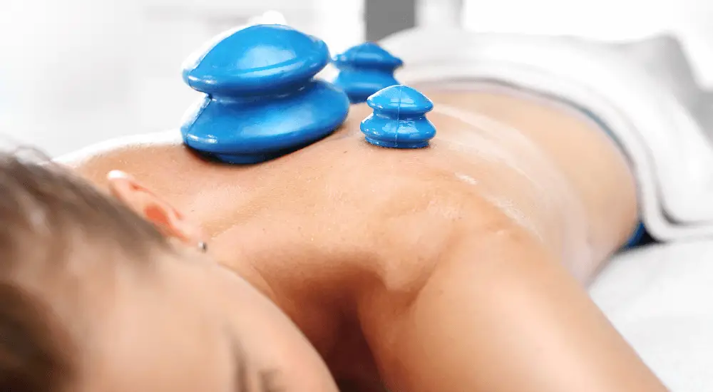massage cups - photo of cups on back during a compression massage